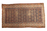 Antique Kurdish runner, classic navy and madder red henna motif, with worn pile and tattered ends.