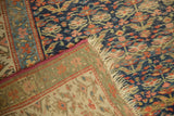 Folded Antique Kurdish Rug Runner corner, showing navy henna motif, woven foundation, and fringe.