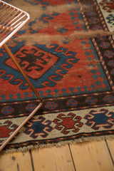 Ivory reciprocating pawn border and textural wear on this antique Caucasian rug.