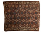 Antique Turkmen Yomud carpet with allover geometric panel design in bronze, ivory, and dark teal.