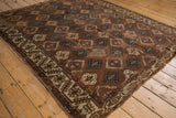 Antique Turkmen Yomud rug, allover bronze, teal, ivory geometric panels, unusual border, patina.