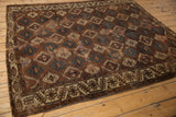 Yomud carpet corner: geometric border, allover brown, ivory, dark teal panel design.