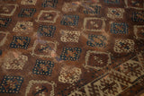 Antique Yomud carpet's bronze, teal, ivory geometric panel design and distinct border.