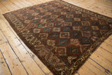 Antique Yomud carpet corner with unique geometric border, bronze and teal aged patina.
