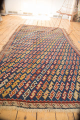 Unusual geometric serpent motif and tattered fringe of a late 19th century Caucasian rug.