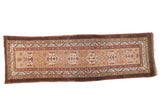 Antique Camel Hair Serab runner with geometric medallions, natural camel field, and aubergine border stripe.