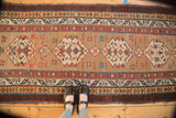 Antique Camel Hair Serab runner with geometric medallions, starburst motifs, and a distinct aubergine border.