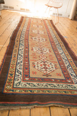 Antique Serab camel hair runner's corner detailing rare aubergine outer border and geometric motifs with overcast ends.