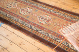 Antique Serab runner's natural camel field, starburst motifs, and rare aubergine stripe border.