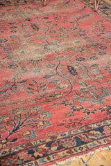 Intricate Persian Lilihan floral vinery and faded blossom branches in dusty raspberry, navy, and beige.