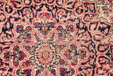 Worn texture and blanched tones of the antique Kerman's intricate floral field.