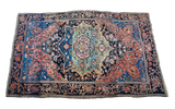 Antique Persian Farahan Sarouk rug, royal blue, seafoam medallion with abrash, and coral floral design.