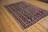 Intricate Herati motif with madder red, indigo blue, and a powder blue selvage on an antique Mahal rug.