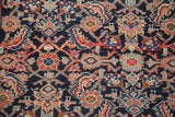 Intricate Herati design on the hand-knotted Mahal rug, featuring rich gem-tone blues and reds.