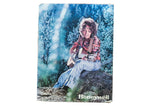 Vintage 1970s Honeywell advertisement print of a woman playing guitar in a forest setting.