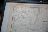 Detail of framed vintage Armonk map, showing corner and discolored mat board.