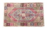 Distressed Oushak rug, elongated medallion, geometric border, vibrant pink, purple, blue. 2'6