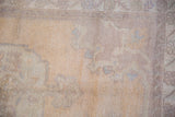 Vintage Distressed Oushak rug showing even wear across knot heads and faded design.