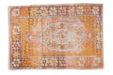 Vintage distressed Oushak rug with elongated orange medallion, saffron yellow, blush florals, 2'10