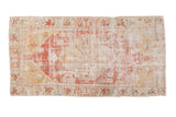 Distressed Oushak runner with faded floral medallion, dusty red, saffron yellow, and silver tones.