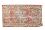 Distressed vintage Oushak runner, cinnabar red field, slate blue medallion, dramatic ivory and tangerine leaves.