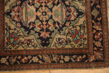 Floral palmettes in the book cover corner spandrel of an antique Farahan Sarouk bag face.