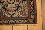 Book cover corner spandrel and original side selvage on an antique Farahan Sarouk bag face rug.