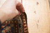 Vintage Farahan Sarouk rug with hand-bound edge, revealing brick red and navy border.