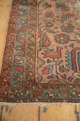 Antique Lilihan rug corner: rose field with stylized birds, multi-layered borders, light fringe wear.