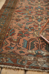 Detailed Lilihan runner with rose, blue, red hand-knotted floral-geometric pattern and bird.