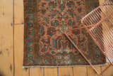 Antique Lilihan runner: dusty blush floral field with geometric birds and serpents.