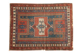Antique Caucasian square rug with geometric double inverted niche design in madder red and teal blue.
