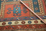 Intricate geometric pattern and borders on an antique Caucasian Farchalou Kazak inspired rug.