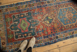 Antique Heriz runner with Karaja-influenced geometric design in madder red and mallard green.