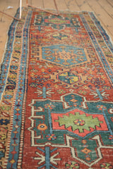 Angled view of antique Heriz runner, rich Karaja design in madder root red and mallard green.
