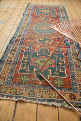 Antique Heriz runner detail: geometric Karaja motifs in cherry red, mallard green, sky blue.