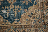 Distressed sky blue Oushak rug field with visible foundation and beige arabesque patterns.