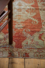 Distressed Oushak runner texture, showing worn red field with ivory serrated leaf pattern.