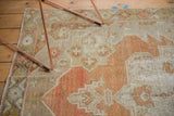 Close-up of the distressed texture with even wear across the vintage Oushak rug.