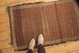 Antique Belouch rug with madder red, brown staggered boteh pattern, zig-zag border.