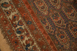 Visible knot heads, foundation, and tattered edge on an antique Northwest Persian rug.