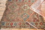 Antique Caucasian fragment square rug with geometric starburst pattern, hard wear, and muted earthy tones. 2'11