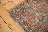 Hard tatter and geometric pattern with exposed foundation on an antique Caucasian rug fragment.