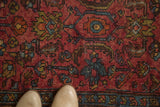 Vintage Lilihan rug detail: raspberry red field, blue, bronze floral patterns, mostly even wear.