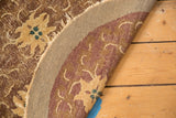 Exposed hand-knotted foundation, worn pile, and tattered edge of an antique Peking rug.