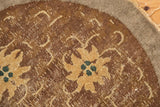 Antique Peking rug: whimsical dusty gold floral design with tendrils, ocean blue accents, and foundation wear.