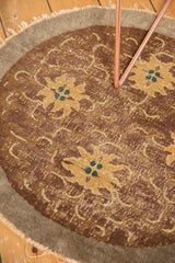 Antique Peking rug with faded gold florals, green blue centers, and visible foundation wear.