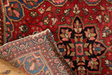 Intricate Farahan Sarouk rug detail showing rich pile, hand-knotted foundation, and aged edge.