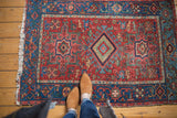 Traditional Heriz area Karaja rug, cherry red field with central diamond medallion and geometric florals.