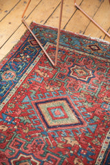 Detail of antique Karaja rug with gem-like cherry red field and blue geometric diamond motif.
